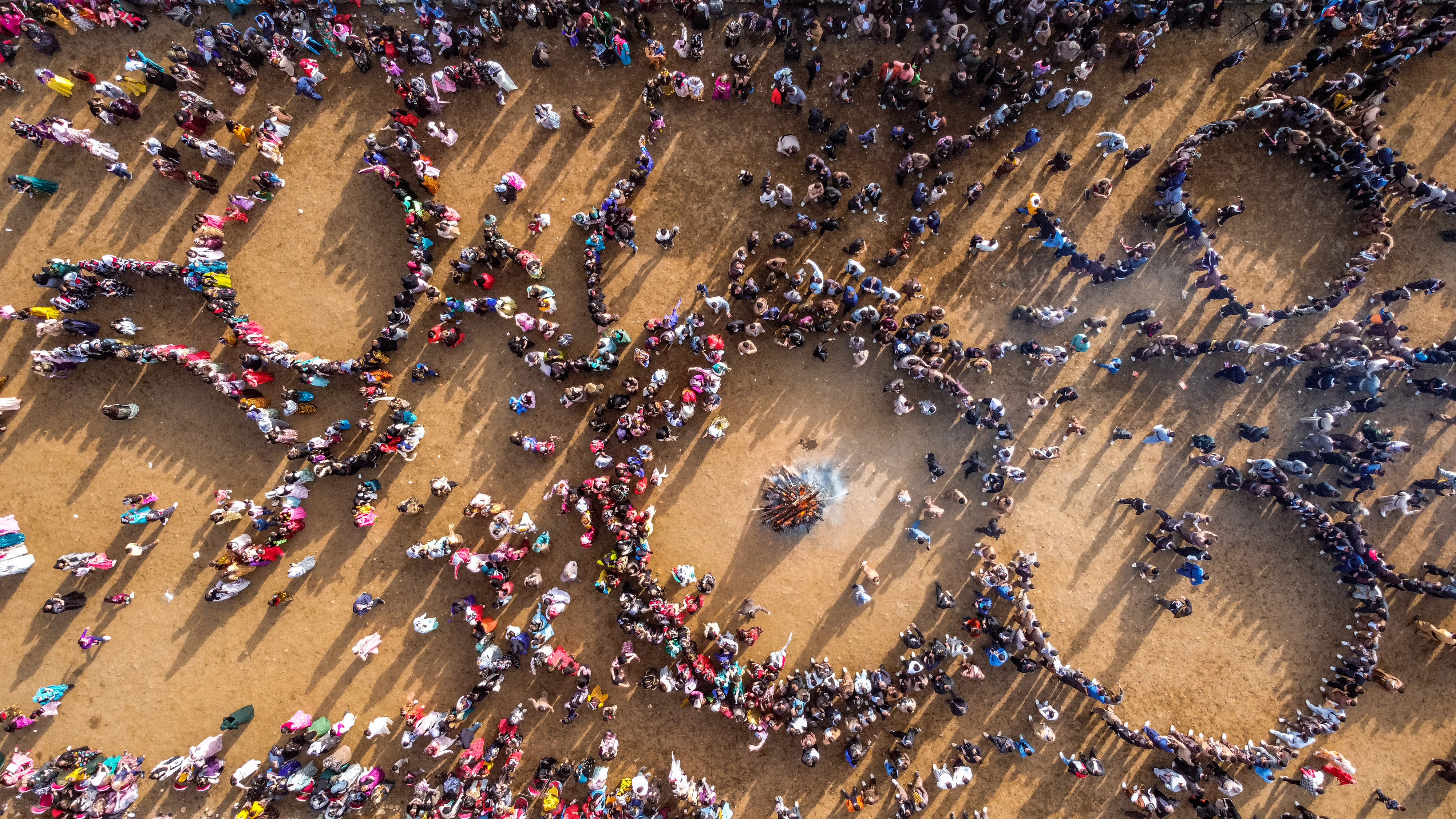 People celebrating Newroz in Kurdistan with a traditional bonfire